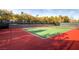 Well maintained tennis court with mature trees and landscaping at 4980 Pensier St, Las Vegas, NV 89135