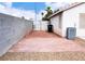 Enclosed backyard with a brick patio, ideal for entertaining or outdoor dining at 5541 Alvarez St, North Las Vegas, NV 89031