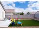 Fenced backyard featuring artificial grass, perfect for outdoor activities and low maintenance at 5541 Alvarez St, North Las Vegas, NV 89031