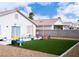 Fenced backyard featuring artificial grass, perfect for outdoor activities and low maintenance at 5541 Alvarez St, North Las Vegas, NV 89031
