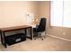 Cozy home office setup with desk, office chair, and bright window overlooking carpeted floor at 5541 Alvarez St, North Las Vegas, NV 89031