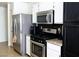 Modern kitchen with stainless steel appliances, updated countertops, and ample storage at 5541 Alvarez St, North Las Vegas, NV 89031