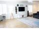 Open living room featuring natural light, neutral decor, and comfortable seating arrangement at 5541 Alvarez St, North Las Vegas, NV 89031