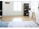 Spacious living area featuring tile floors, neutral tones, and a stylish area rug at 5541 Alvarez St, North Las Vegas, NV 89031