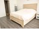 Serene main bedroom features a large bed with drawers and hardwood flooring at 5541 Alvarez St, North Las Vegas, NV 89031