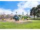 Community park featuring a playground, green lawns, and shady trees at 5541 Alvarez St, North Las Vegas, NV 89031