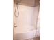 Bright shower and tub feature a shower head and tiled surround at 5541 Alvarez St, North Las Vegas, NV 89031
