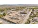 Expansive construction site featuring graded dirt and landscaping, set against a backdrop of mountains and lush greenery at 5885 St Ebbes Ct, Las Vegas, NV 89131