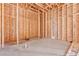 Unfinished primary bathroom shows a concrete slab and wood framing ready for customizing to your dream space at 5885 St Ebbes Ct, Las Vegas, NV 89131