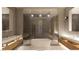 Contemporary bathroom featuring a freestanding tub, dual vanities, and a glass-enclosed shower at 5885 St Ebbes Ct, Las Vegas, NV 89131