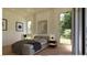 This primary bedroom has natural light, neutral walls, and minimalist decor at 5885 St Ebbes Ct, Las Vegas, NV 89131