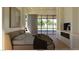 Comfortable bedroom with king bed, fireplace, and access to the outdoors at 5885 St Ebbes Ct, Las Vegas, NV 89131