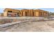 Image of a new home under construction with heavy construction equipment on site at 5885 St Ebbes Ct, Las Vegas, NV 89131