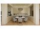 Bright dining area with a round table, seating for eight, contemporary lighting, and built-in shelving for storage and decor at 5885 St Ebbes Ct, Las Vegas, NV 89131