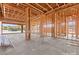 Unfinished dining room showing wooden beam framing of the house during the construction phase, customize it to your preference at 5885 St Ebbes Ct, Las Vegas, NV 89131