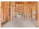 Unfinished foyer showcasing the home's wooden beam framing during the construction phase, offering customization options at 5885 St Ebbes Ct, Las Vegas, NV 89131