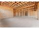 Unfinished game room showcasing its spacious layout and wood framing at 5885 St Ebbes Ct, Las Vegas, NV 89131