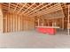 Unfinished Gathering room with wooden beam framing allows future buyers to customize the room to fit their personal style at 5885 St Ebbes Ct, Las Vegas, NV 89131