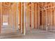 Unfinished hallway with wood frame shows passage to other rooms at 5885 St Ebbes Ct, Las Vegas, NV 89131