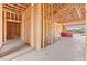 During construction, the unfinished hallway with wooden beam framing allows buyers to see a clear path for remodeling ideas at 5885 St Ebbes Ct, Las Vegas, NV 89131