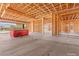 An unfinished kitchen with wooden beam framing during construction provides an open space for buyers to design their own layouts at 5885 St Ebbes Ct, Las Vegas, NV 89131