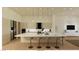 Contemporary kitchen with a large island, bar stools, pendant lighting, and stainless steel appliances at 5885 St Ebbes Ct, Las Vegas, NV 89131