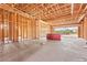 The unfinished kitchen with wooden beam framing during construction gives the buyer a blank canvas for their preferences at 5885 St Ebbes Ct, Las Vegas, NV 89131
