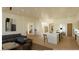 Open living area with a kitchen island, cozy seating, and seamless access to the dining space at 5885 St Ebbes Ct, Las Vegas, NV 89131