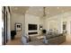 Bright living room features a modern fireplace, hardwood floors, and a gray L-shaped couch at 5885 St Ebbes Ct, Las Vegas, NV 89131