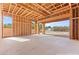 Unfinished primary bedroom features wood framing and large windows offering natural light and views at 5885 St Ebbes Ct, Las Vegas, NV 89131
