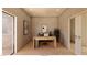 Bright home office with modern desk, artwork, ceiling fan, and hardwood floors at 5885 St Ebbes Ct, Las Vegas, NV 89131