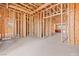 An unfinished office with wooden beams allows buyers to see a clear path for customization and their own creativity at 5885 St Ebbes Ct, Las Vegas, NV 89131