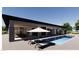 Gorgeous backyard with pool, hot tub, lounge chairs, and covered patio perfect for entertaining at 5885 St Ebbes Ct, Las Vegas, NV 89131