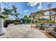 Expansive backyard featuring a concrete patio, wood pergola, seating area, and lush landscaping at 604 I, Boulder City, NV 89005