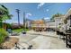 Spacious backyard with a concrete patio, pergola, and seating area, perfect for outdoor entertaining at 604 I, Boulder City, NV 89005
