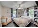 Cozy bedroom with a ceiling fan, ample natural light, and stylish floral print curtains at 604 I, Boulder City, NV 89005