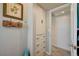 Hallway with built-in storage and access to an adjoining room, with tile floor at 604 I, Boulder City, NV 89005