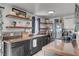 Bright kitchen with floating shelves, stylish decor, and stainless steel appliances at 604 I, Boulder City, NV 89005