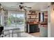 Open dining area leading to the backyard featuring tile floors, and modern design at 604 I, Boulder City, NV 89005