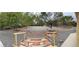 Expansive backyard featuring mature trees, gravel ground cover, decorative rock and a storage shed at 6460 Wagon Wheel Ct, Pahrump, NV 89061