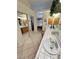 Bathroom featuring dual sinks, natural wood cabinetry and a decorative tile countertop at 6460 Wagon Wheel Ct, Pahrump, NV 89061