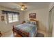 Cozy bedroom features a comfortable bed, ceiling fan, and plenty of natural light at 6460 Wagon Wheel Ct, Pahrump, NV 89061