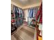 Walk-in closet with organized storage, including shelves and hanging rods for ample space at 6460 Wagon Wheel Ct, Pahrump, NV 89061