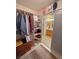 Walk-in closet with built-in shelves and hanging rods offering substantial storage solutions at 6460 Wagon Wheel Ct, Pahrump, NV 89061