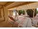 Inviting covered patio with a comfortable swing at 6460 Wagon Wheel Ct, Pahrump, NV 89061