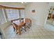 Dining area filled with natural light from large windows with bench and dining set at 6460 Wagon Wheel Ct, Pahrump, NV 89061