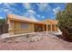 Charming single-story home with a covered patio and desert landscaping at 6460 Wagon Wheel Ct, Pahrump, NV 89061