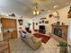 Bright living room features vaulted ceilings, fireplace, and access to other rooms in the home at 6460 Wagon Wheel Ct, Pahrump, NV 89061