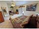 Main bedroom showcases a king bed, TV, and sliding door to the backyard at 6460 Wagon Wheel Ct, Pahrump, NV 89061