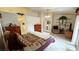 Spacious main bedroom with a mix of furnishings, decor, and access to an en-suite bathroom at 6460 Wagon Wheel Ct, Pahrump, NV 89061